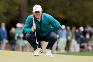 Rory McIlroy of Northern Ireland lines up a putt on the first green during the third round of the Masters at Augusta National Golf Club on April 09, 2022 in Augusta, Georgia.