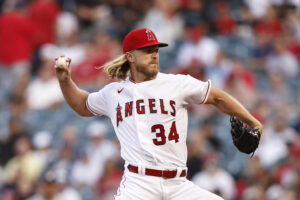 Noah Syndergaard #34 of the Los Angeles Angels pitches against the Houston Astros during the first inning at Angel Stadium of Anaheim on April 09, 2022 in Anaheim, California.