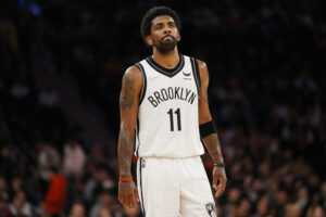 Kyrie Irving #11 of the Brooklyn Nets looks on during the second half against the New York Knicks at Madison Square Garden on April 06, 2022 in New York City. The Nets won 110-98. 