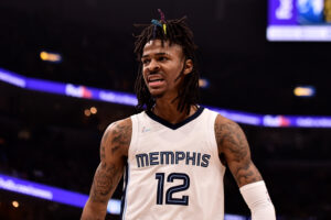 Ja Morant #12 of the Memphis Grizzlies reacts during Game One of the Western Conference First Round against the Minnesota Timberwolves at FedExForum on April 16, 2022 in Memphis, Tennessee.