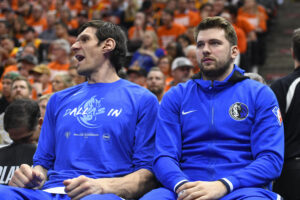 Luka Doncic (right) and Boban Marjonvic (right) of the Dallas Mavericks sits on the bench during the first half of Game Three of the Western Conference First Round Playoffs against the Utah Jazz at Vivint Smart Home Arena on April 21, 2022 in Salt Lake City, Utah.