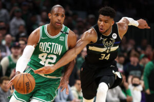 Giannis Antetokounmpo #34 of the Milwaukee Bucks steals the ball from Al Horford #42 of the Boston Celtics