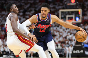 Tobias Harris (right) of the Philadelphia 76ers drives to the basket against Victor Oladipo (left) of the Miami Heat during the first half in Game One of the Eastern Conference Semifinals at FTX Arena on May 02, 2022 in Miami, Florida.