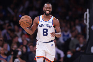 New York Knicks guard Kemba Walker dribbles up court against the Philadelphia 76ers 