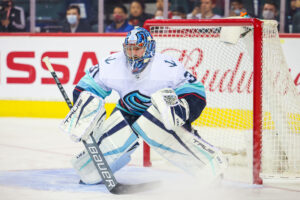 Seattle Kraken goaltender Philipp Grubauer prepares to make a save on a puck