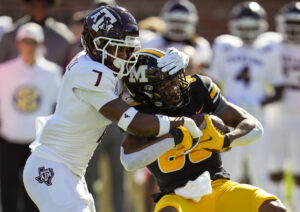 Missouri wide receiver Tauskie Dove is tackled by Texas A&M defensive back Tyreek Chappell