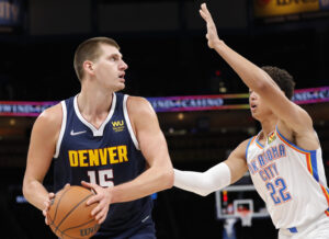 Denver Nuggets center Nikola Jokic is guarded by Oklahoma City Thunder center Isaiah Roby