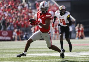 Ohio State Buckeyes wide receiver Chris Olave runs the ball after a reception