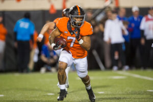 Oklahoma State Cowboys running back Jaylen Warren runs during the second quarter against the Kansas Jayhawks