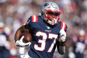 New England Patriots running back Damien Harris runs with the ball during the first half against the New York Jets