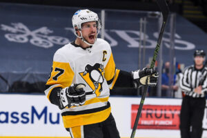 Pittsburgh Penguins center Sidney Crosby celebrates after a teammate scores a goal