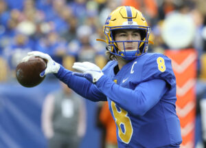 University of Pittsburgh quarterback Kenny Pickett winds up to throw a pass