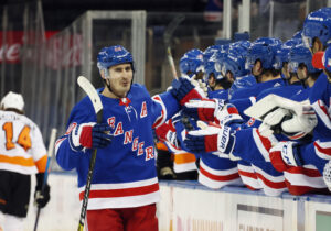 New York Rangers forward Chris Kreider celebrates with teammates after scoring a goal