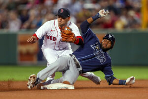 Tampa Bay Rays right fielder Manuel Margot slides into second base as Boston Red Sox shortstop Jose Iglesias catches the ball