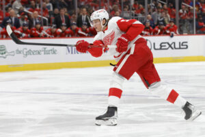 Detroit Red Wings defenseman Moritz Seider shoots the puck against the Washington Capitals