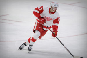 Detroit Red Wings left wing Taro Hirose skates with the puck on ice