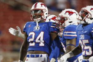 Southern Methodist Mustangs linebacker Jimmy Phillips Jr. reacts with teammates after a play 