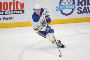 Buffalo Sabres center Jack Eichel skates with the puck on ice