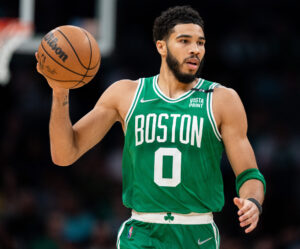 Jayson Tatum #0 of the Boston Celtics brings the ball up court in the first quarter against the Charlotte Hornets at Spectrum Center on March 09, 2022 in Charlotte, North Carolina.