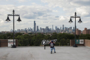 A fan takes a photo of the skyline before a game between the Chicago White Sox and the Toronto Blue Jays at Guaranteed Rate Field. 