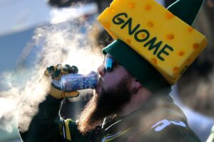 NFL Divisional Playoff Odds - Chris St. Amour of Green Bay braves the cold to enjoy a beverage while tailgating before the Green Bay Packers play against the Chicago Bears Sunday, December 15, 2019, at Lambeau Field in Green Bay, Wis. 2019 Mjs Apc Packvsbears 1215190102