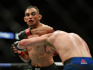 Tony Ferguson (left) throws a left elbow that Justin Gaethje (right) ducks under during UFC 249