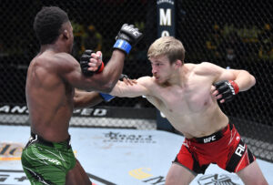 Arnold Allen of England (right) throws a punch with his right hand that misses connecting on opponent Sodiq Yusuff of Nigeria in a featherweight UFC Fight Night bout