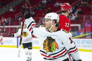 Chicago Blackhawks left wing Alex DeBrincat (12) scores his game winning overtime goal against the Carolina Hurricanes at PNC Arena.