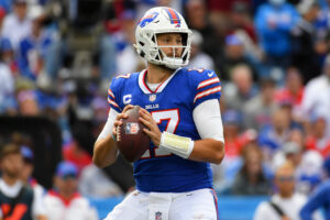 Buffalo Bills QB #17 Josh Allen looks downfield during a pass attempt in a 2021 home game in Buffalo, NY.