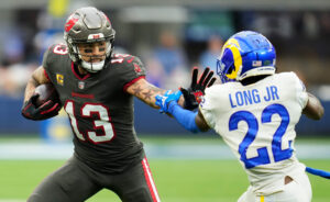 Tampa Bay Buccaneers wide receiver Mike Evans (left) tries to run past Los Angeles Rams defensive back David Long (right)