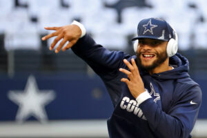 Dallas Cowboys quarterback Dak Prescott warms up before a 2021 home game.