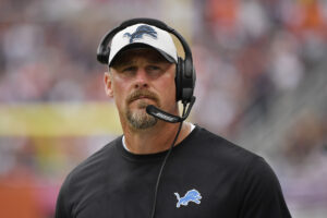 Detroit Lions coach Dan Campbell looks up from the sidelines during a game