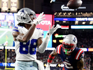 Dallas Cowboys wide receiver CeeDee Lamb (left) catches a pass against the New England Patriots