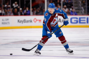 Colorado Avalanche center Nathan MacKinnon (29) passes the puck in the third period against the Vegas Golden Knights at Ball Arena.