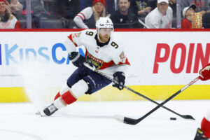 Florida Panthers center Sam Bennett (9) skates with the puck against the Detroit Red Wings at Little Caesars Arena. 