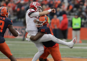 Illinois Fighting Illini defensive lineman Keith Randolph Jr. tackles Rutgers Scarlet Knights quarterback Noah Vedral