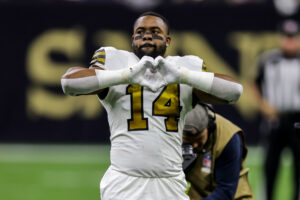 New Orleans Saints running back Mark Ingram II makes a heart symbol with his hands during pregame introductions