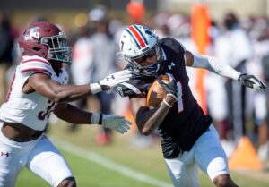 Jackson State University's Keith Corbin III (7) gets around Texas Southern University's Marquis Walker (38) during their game at Mississippi Veterans Memorial Stadium in Jackson, Miss., Saturday, Nov. 6, 2021.