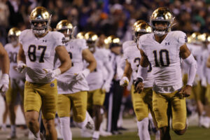 The Notre Dame Fighting Irish take to the field prior to their game against the Virginia Cavaliers