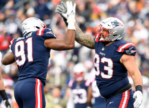 New England Patriots defensive end Deatrich Wise (91) and defensive end Lawrence Guy (93) react after a sack against the Cleveland Browns