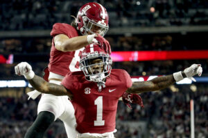 Alabama Crimson Tide wide receiver Jameson Williams (1) celebrates with Alabama Crimson Tide tight end Cameron Latu (81) after scoring a touchdown against the Arkansas Razorbacks during the second half at Bryant-Denny Stadium.