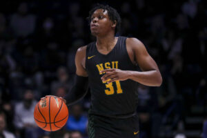 Norfolk State Spartans guard Cahiem Brown dribbles the basketball with his right hand during a game against the Xavier Musketeers