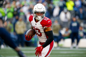 Arizona Cardinals wide receiver Christian Kirk (13) runs for yards after the catch against the Seattle Seahawks during the second quarter at Lumen Field.