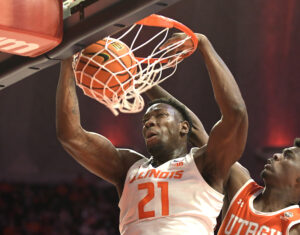 Illinois Fighting Illini center Kofi Cockburn (left) dunks the ball as Texas Rio Grande Valley forward RayQuan Taylor (right) tries to defend