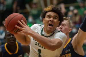 Colorado State basketball guard John Tonje makes a drive to the basket during the Rams' game against Northern Colorado