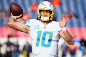 Los Angeles Chargers quarterback Justin Herbert throws the ball during pregame warmups before a game against the Denver Broncos