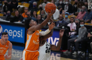 Tennessee Volunteers guard Kennedy Chandler shoots the ball over Colorado Buffaloes guard Elijah Parquet