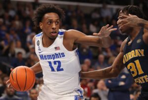 Memphis Tigers forward DeAndre Williams (left) drives the baseline past Murray State Racers forward Jordan Skipper-Brown (right)