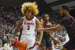 Alabama Crimson Tide guard JD Davison (left) reacts after making the go-ahead basket against Houston Cougars