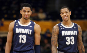 Monmouth Hawks guards Marcus McClary (left) and Shavar Reynolds (right) smile as they react on the court during a game against he Pittsburgh Panthers